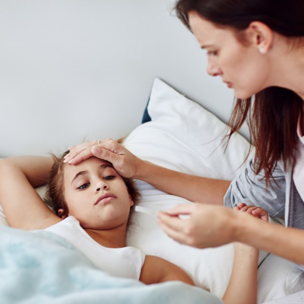 Parent taking child’s temperature